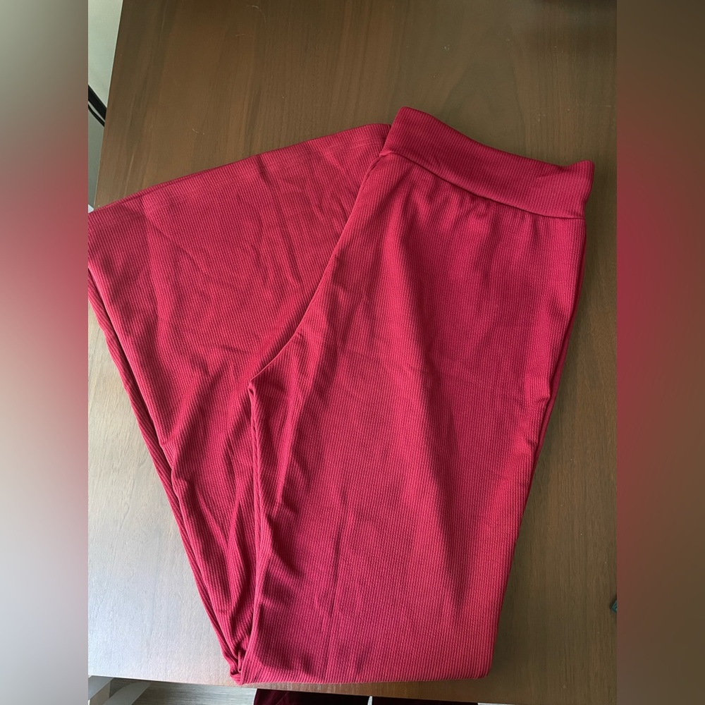 High waisted, red flare, pants ripped